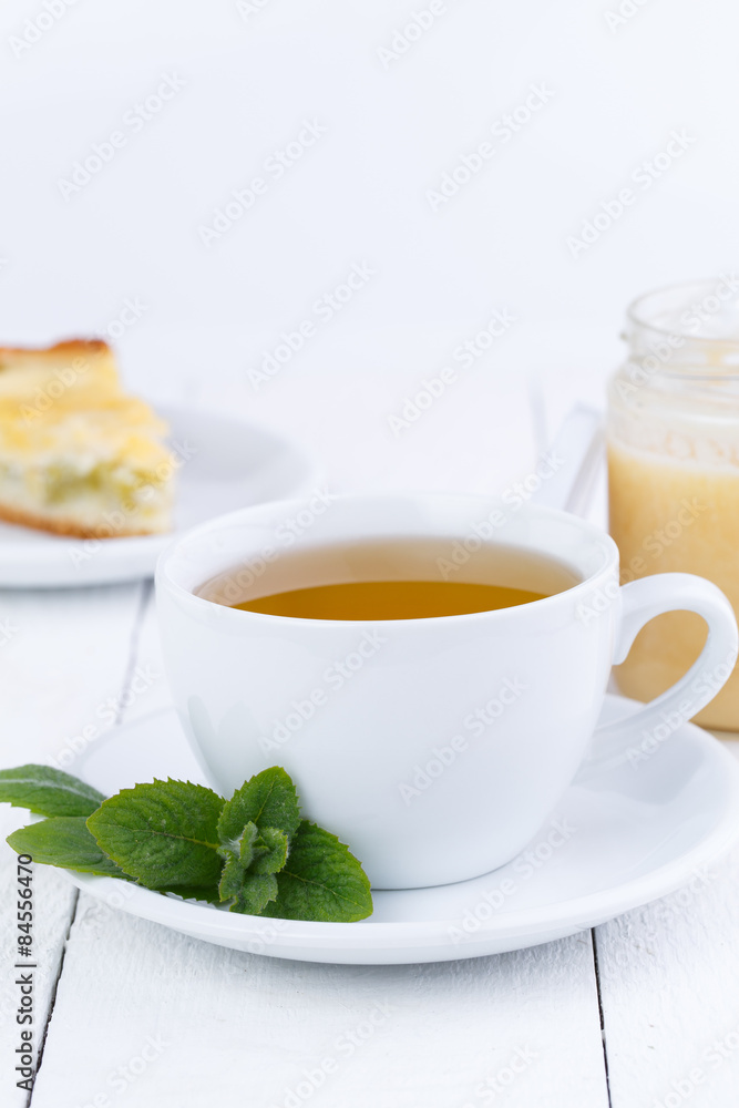 Mint tea with honey on wooden table. Mint tea with honey on wooden table.