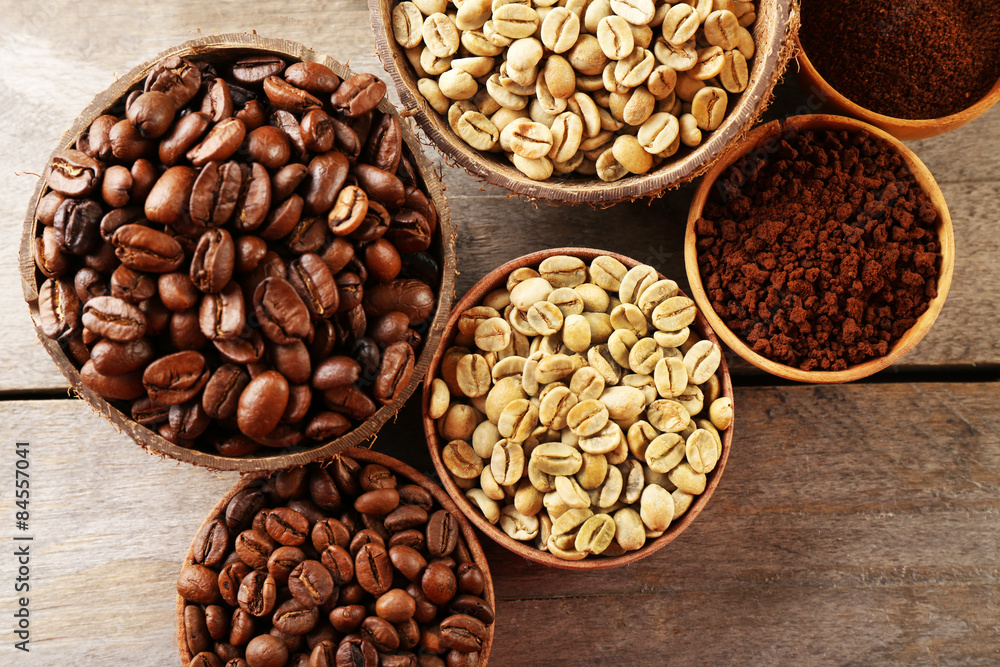 Fototapeta premium Various of coffee in small dishes on wooden table, top view