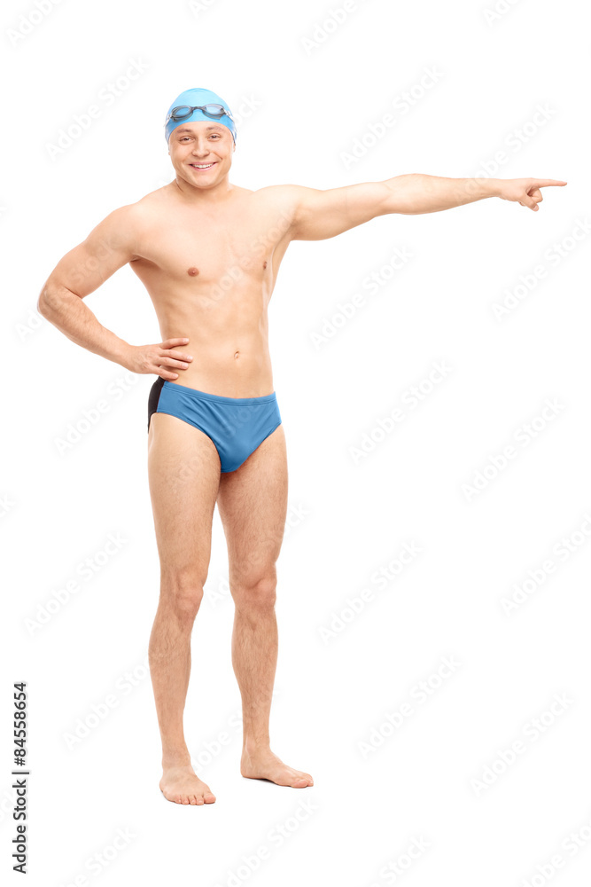 Young handsome swimmer pointing right with his hand