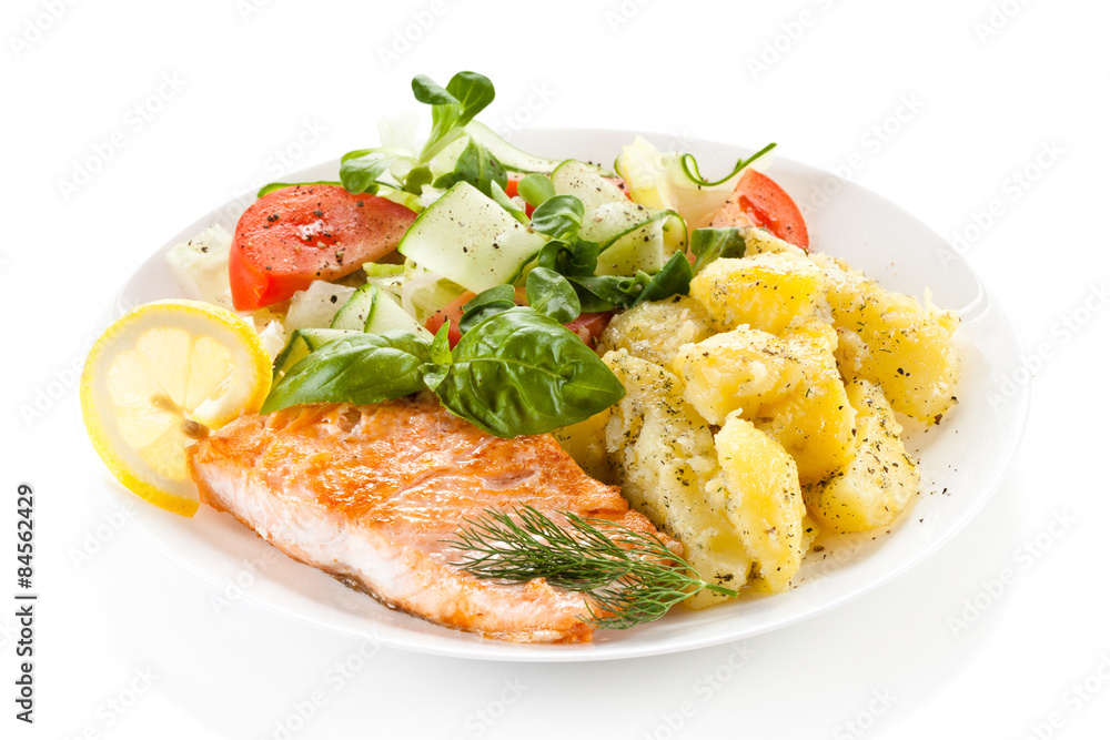 Fried salmon and vegetables on white background Fried salmon and vegetables on white background