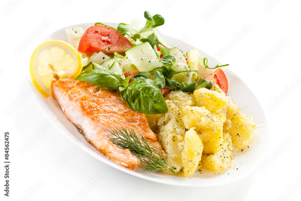 Fried salmon and vegetables on white background Fried salmon and vegetables on white background