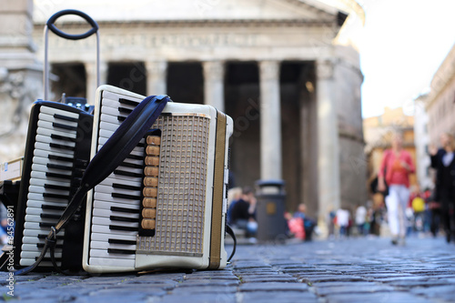 Fototapeta Naklejka Na Ścianę i Meble -  Accordion and harmonica in the background of  Pantheon in Rome