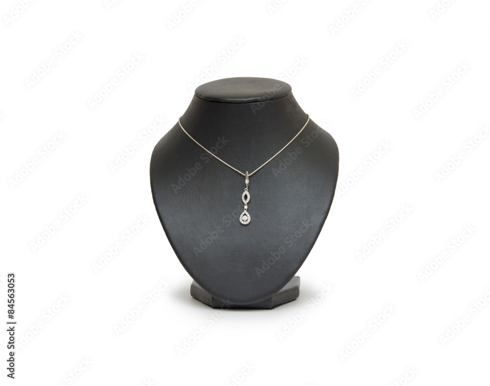 Diamond necklace on black mannequin isolated on white background Diamond necklace on black mannequin isolated on white background