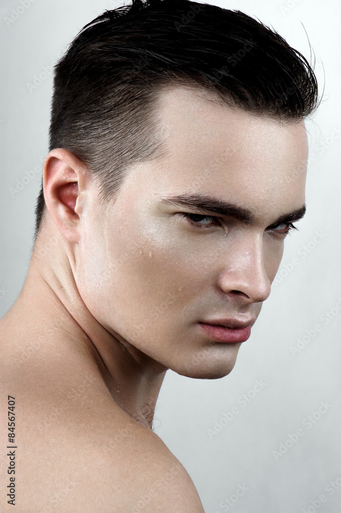 Fototapeta premium Fashion male model with drops on face