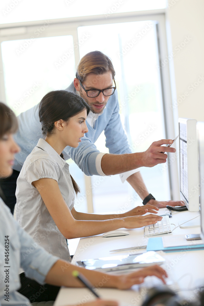 Obraz premium Creative people working in office on computer