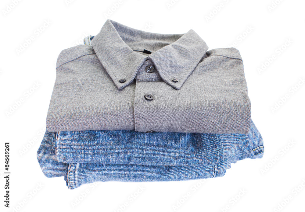 Grey cotton shirt and blue jean on white backgroun Grey cotton shirt and blue jean on white backgroun