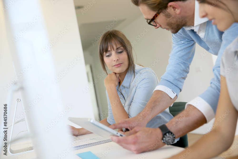 Business people working in office, meeting with tablet Business people working in office, meeting with tablet