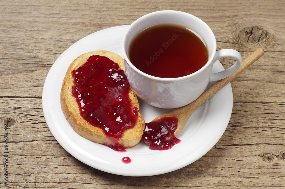 Tea cup and bread with jam Tea cup and bread with jam