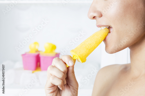 Beautiful woman eating ice cream