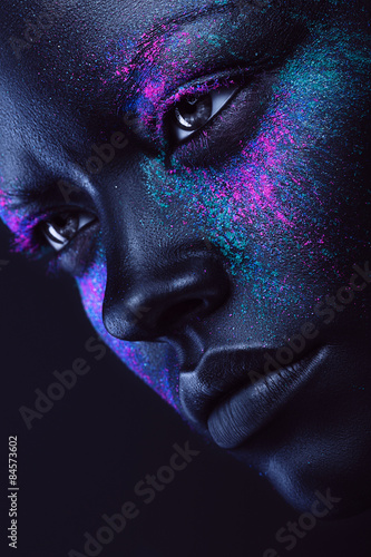 woman in black paint and neon powder