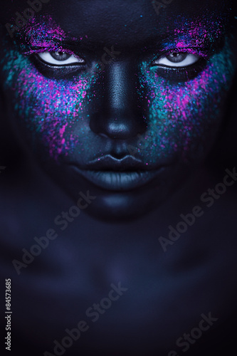 woman in black paint and pink powder