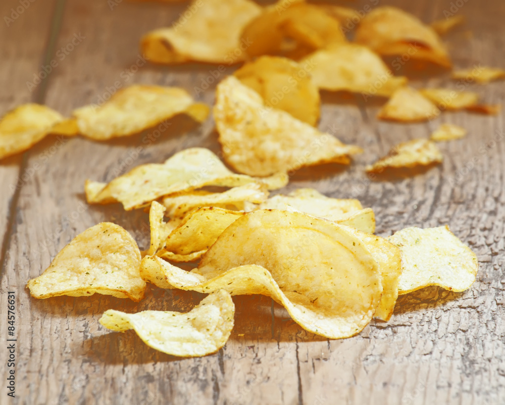 Golden potato chips, selective focus