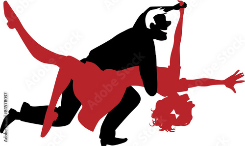 Silhouette of a couple dancing swing or rock n roll