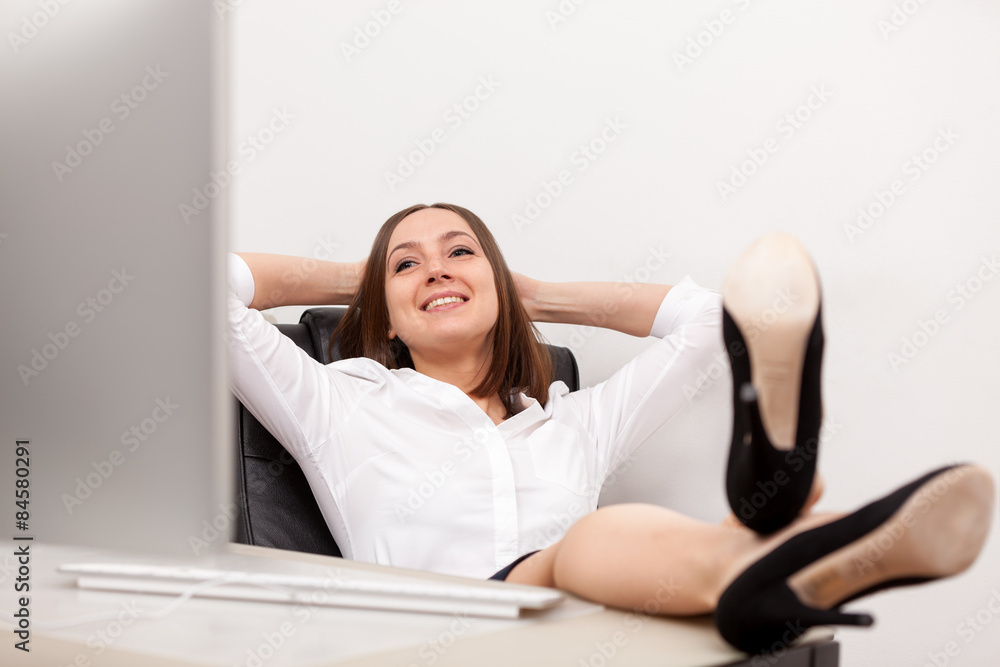 Relaxed businesswoman at her desk Relaxed businesswoman at her desk
