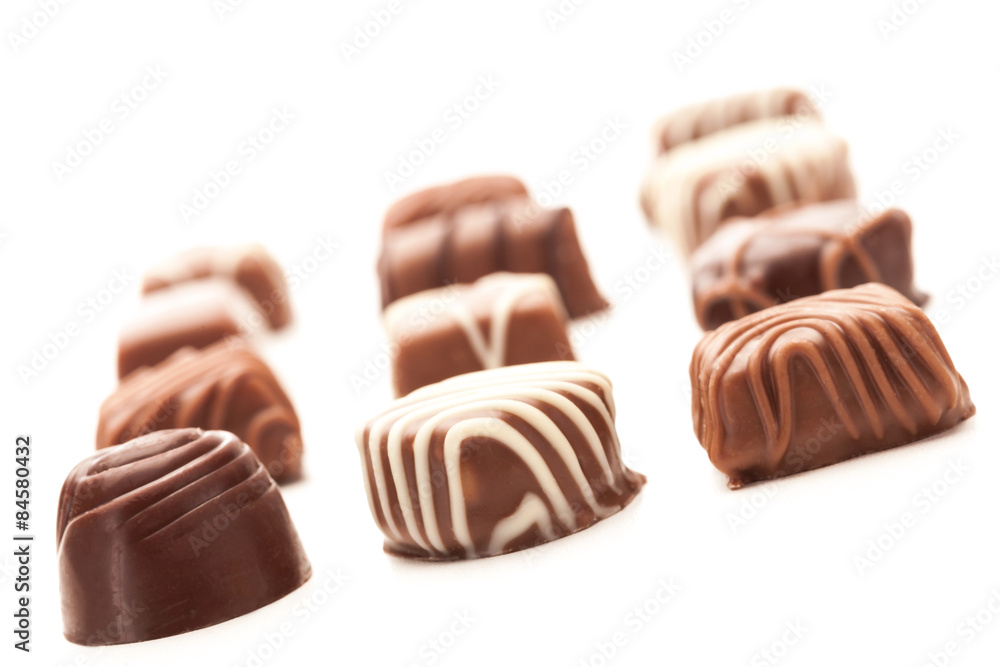 Chocolate pralines over white isolated background Chocolate pralines over white isolated background