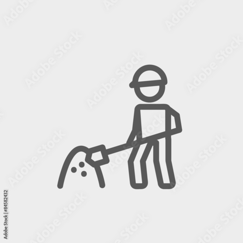 Worker with hard hat and shovel in building site thin line icon