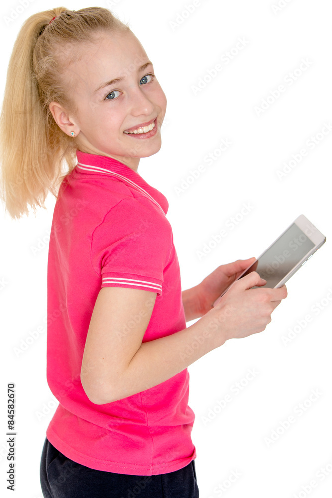Beautiful Caucasian girl holding a tablet and smiling while stan Beautiful Caucasian girl holding a tablet and smiling while stan