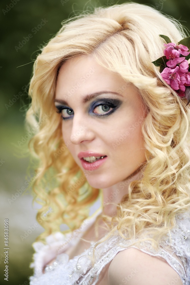 Portrait beautiful young bride in white dress in summer green park Portrait beautiful young bride in white dress in summer green park