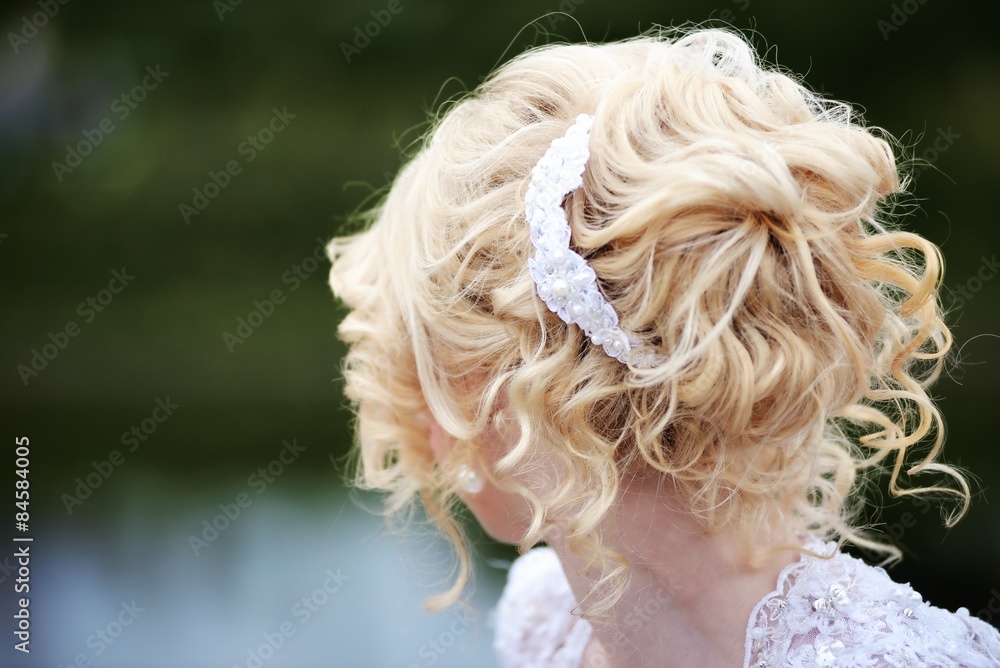 Fototapeta premium Beauty wedding hairstyle with hairpin
