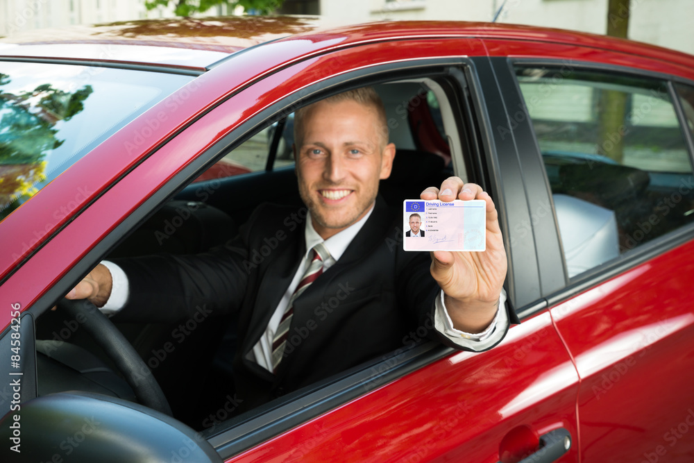 Businessman Showing His Driving License