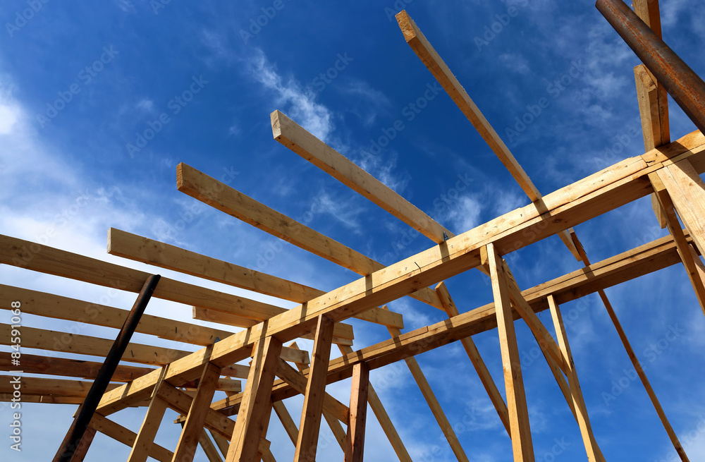 Installation of wooden beams at construction the roof truss syst Installation of wooden beams at construction the roof truss syst