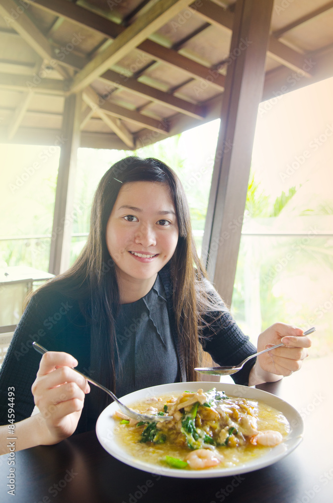 Young asian woman eating noodles Young asian woman eating noodles