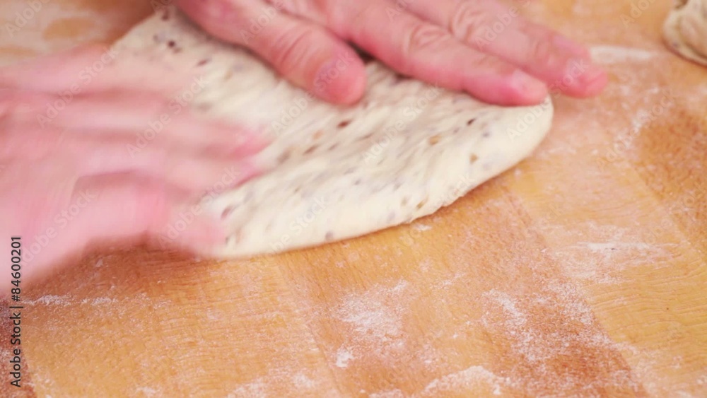 Bread making - kneading dough, making loafs; closeup Bread making - kneading dough, making loafs; closeup