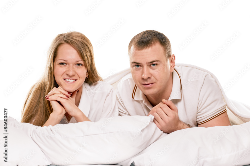 Couple lying in bed smiling Couple lying in bed smiling