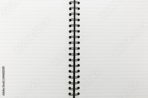 white notebook with line on cork board