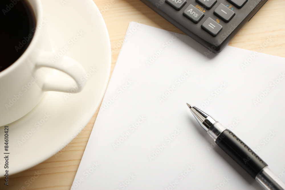White paper calculator and coffee White paper calculator and coffee