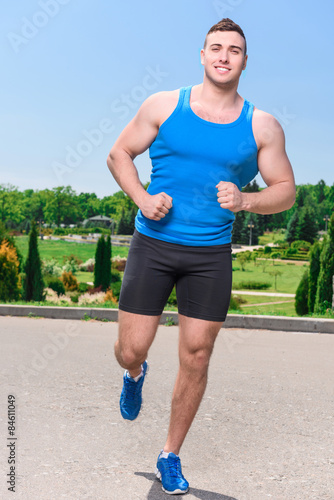 Muscled sportsman during training