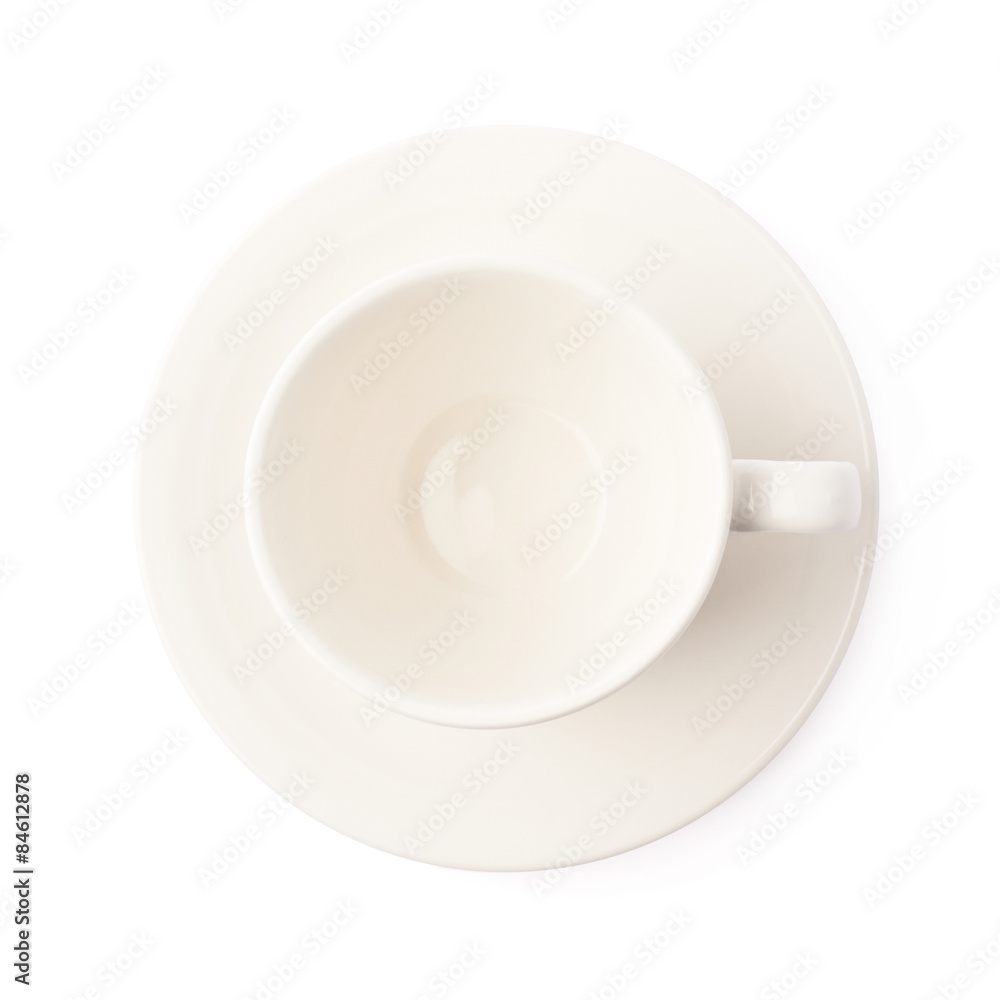 White ceramic cup on a plate isolated White ceramic cup on a plate isolated