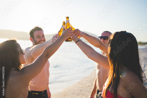 group of young multiethnic friends beach summer