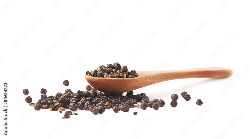 Wooden spoon and black peppercorn Wooden spoon and black peppercorn