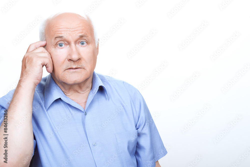 Puzzled grandfather involved in thinking Puzzled grandfather involved in thinking