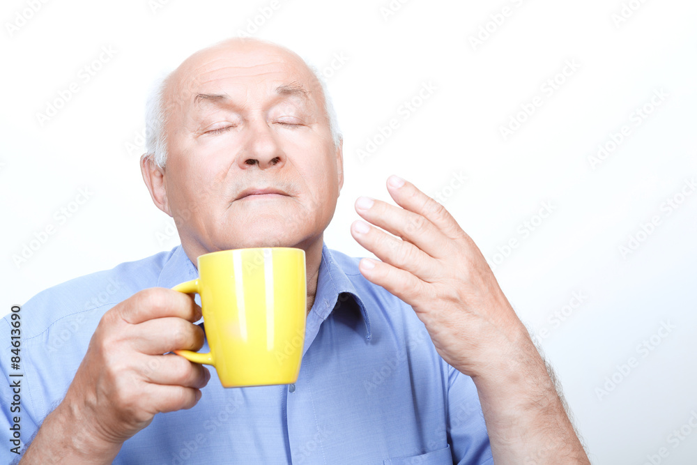 Nice grandfather smelling tea aroma Nice grandfather smelling tea aroma