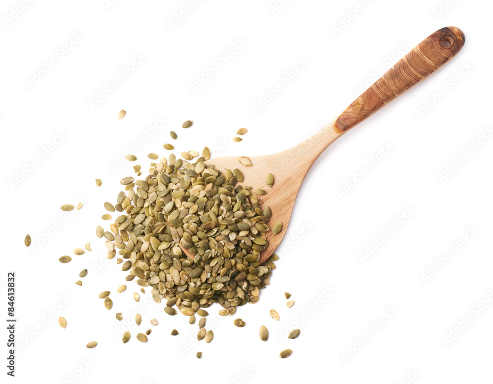 Wooden spoon covered with pumpkin seeds Wooden spoon covered with pumpkin seeds