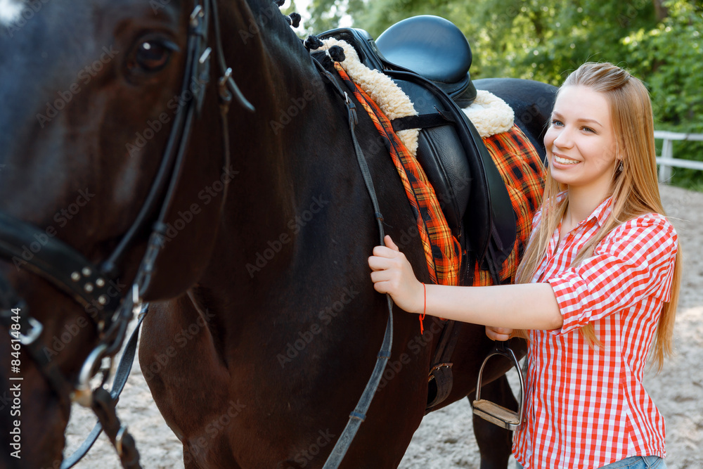 Obraz premium Girl standing near the horse 
