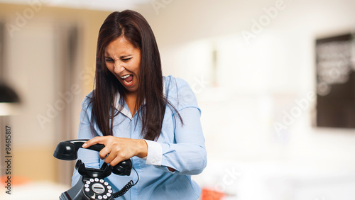 angry young-woman with telephone