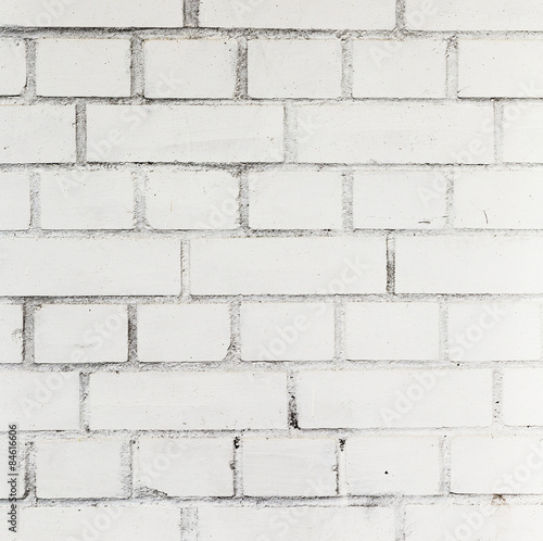  white painted bricks at an old house wall