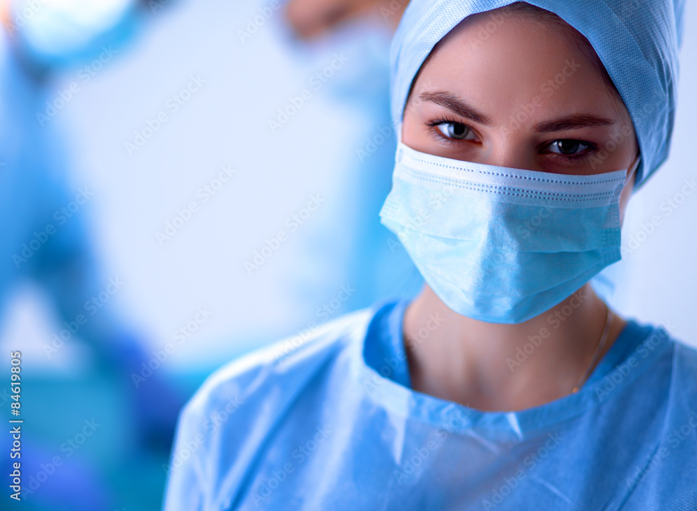 Team surgeon at work in operating room. Team surgeon at work in operating room.