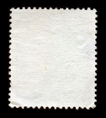 Reverse side of a postage stamp.
