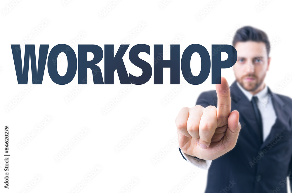 Business man pointing the text: Workshop Business man pointing the text: Workshop
