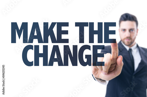 Business man pointing the text: Make the Change