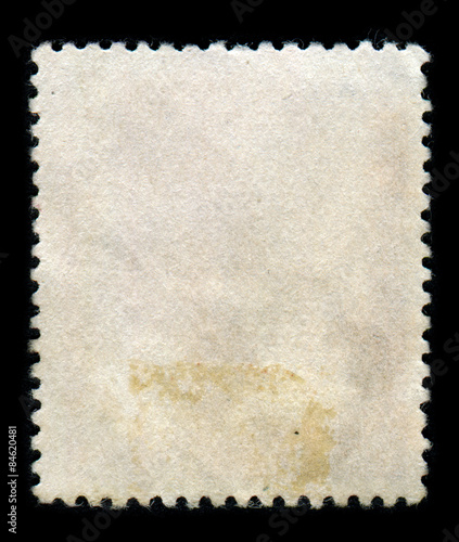 Reverse side of a postage stamp.