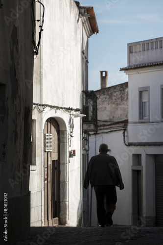Silhouette of man on the streets of Beja, Portugal.