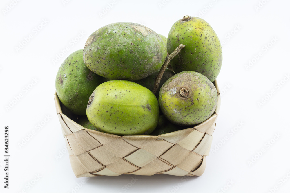 Hog plum in bamboo basket with isolate background. Hog plum in bamboo basket with isolate background.