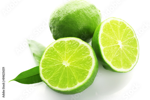 Sliced fresh limes isolated on white