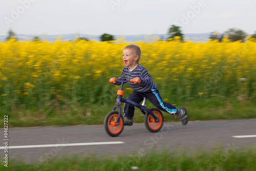 Little boy on a bicycle.