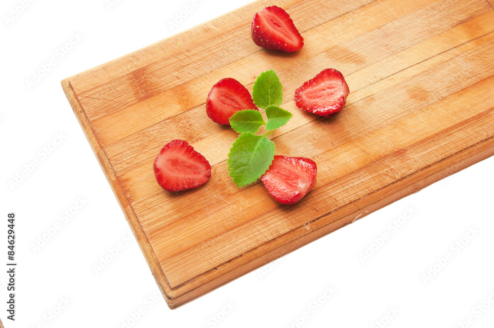 sliced strawberries on a wooden board sliced strawberries on a wooden board